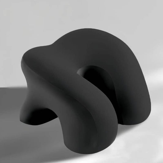 Black, abstract-shaped object on a gray background