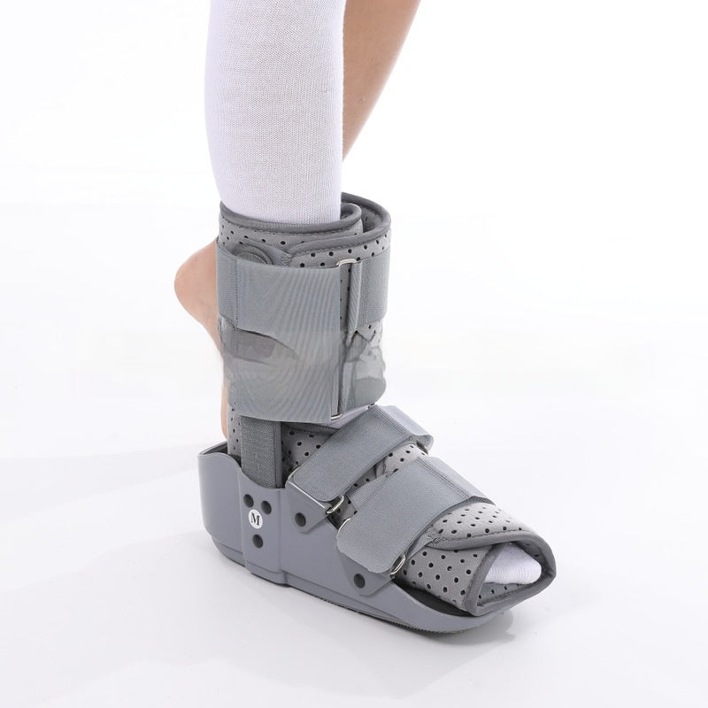 Gray below-knee orthotic boot on a white background