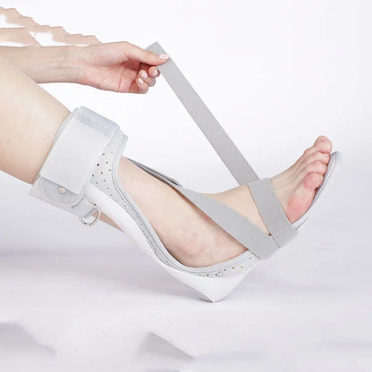 White sandal with transparent straps being worn on a white background