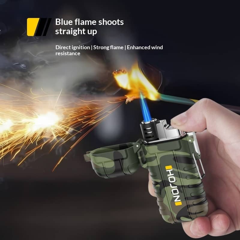 Hand holding a green and black lighter with blue flame, sparks, and text on a dark background.