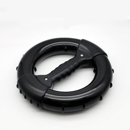 Black circular tool with handle on a white background