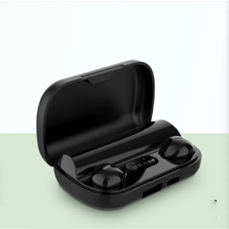 Black wireless earbuds in a charging case on a light green background