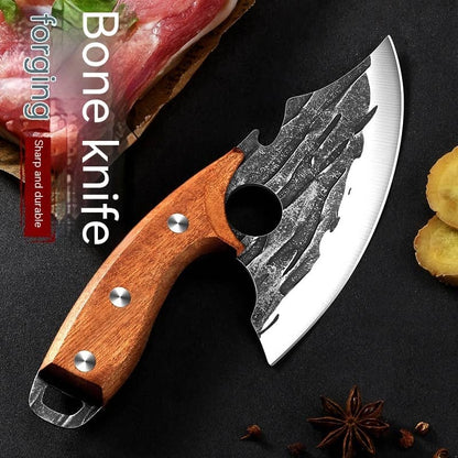 Forged bone knife with wood handle, sharp blade, next to raw meat and spices on black surface