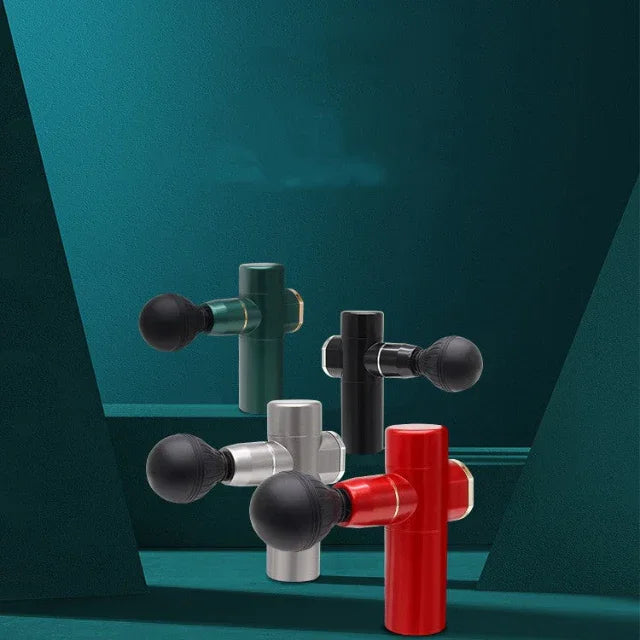 Four compact handheld massage guns in red, black, silver, and green on green geometric background for muscle recovery