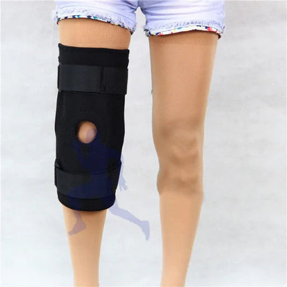 Woman wearing adjustable black knee brace support, shorts, fitness injury recovery