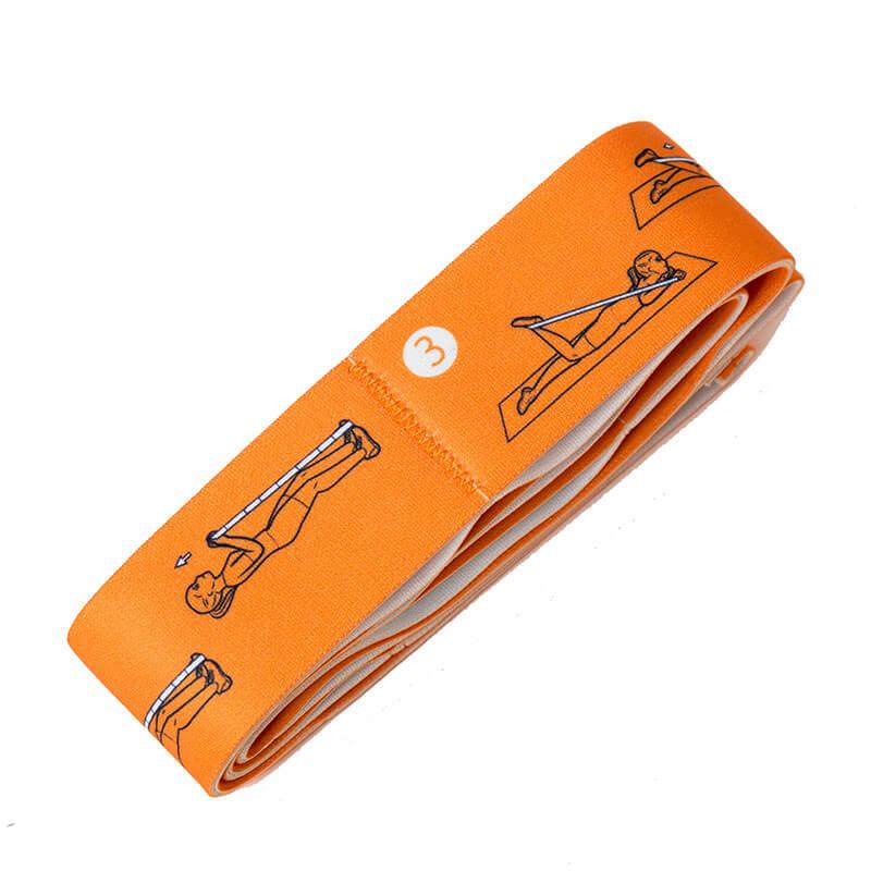 Orange resistance band with exercise instructions illustrations for strength training