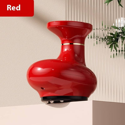 Red vase with gold accent on a neutral background