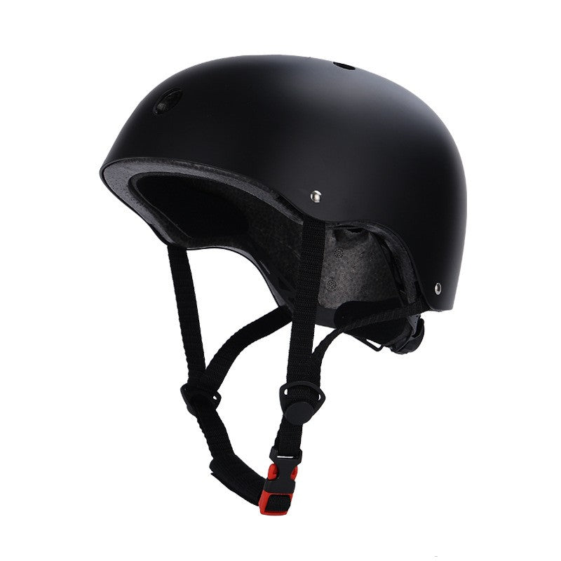 Black helmet with chin strap on a white background