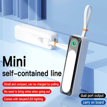 Mini portable power bank with USB ports, LED lighting, and built-in charging cable, compact size