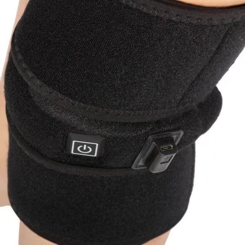 Black heated knee brace with power button and USB charging port for fitness recovery