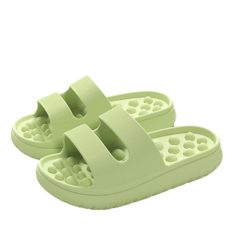 Light green sandals with textured sole on a white background