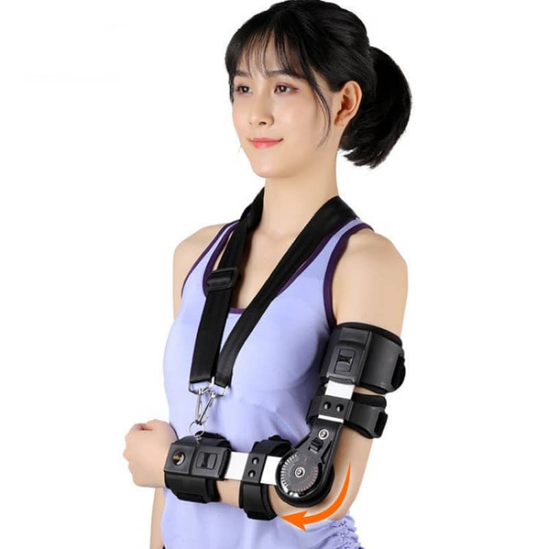 Woman wearing a black arm brace on a white background