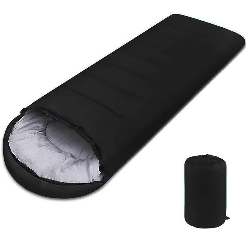 Black rectangular sleeping bag with light interior and compact carrying case, ideal for camping.