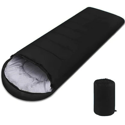 Black rectangular sleeping bag with light interior and compact carrying case, ideal for camping.