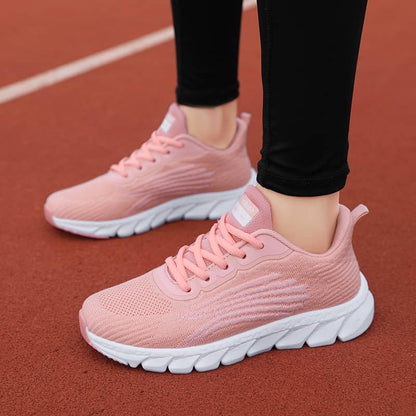 Pink running shoes on a track