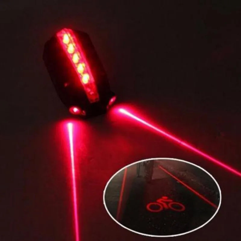 Bicycle tail light with laser projection on a dark background
