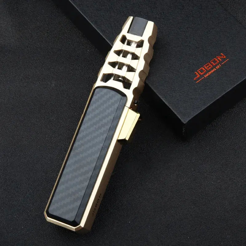 Sleek gold and black JOBON lighter on black surface, premium fitness and outdoor gear accessory
