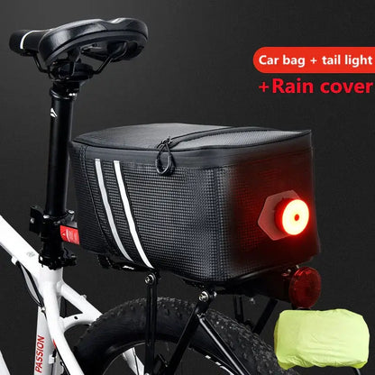 Bike rear rack bag with tail light and rain cover, mounted on a white bicycle