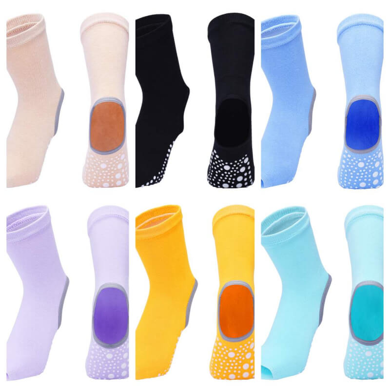 Collection of colorful socks with textured sole designs on a white background