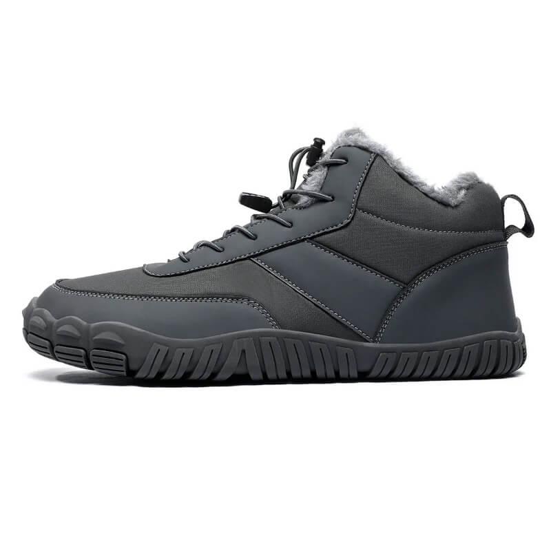 Gray insulated athletic hiking boot with fur lining and rugged sole, side view