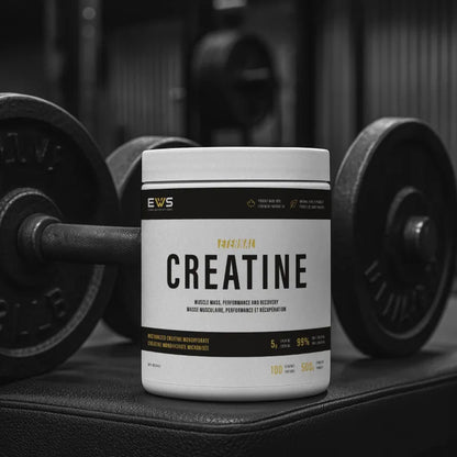 Container of EWS Creatine with gym equipment in the background
