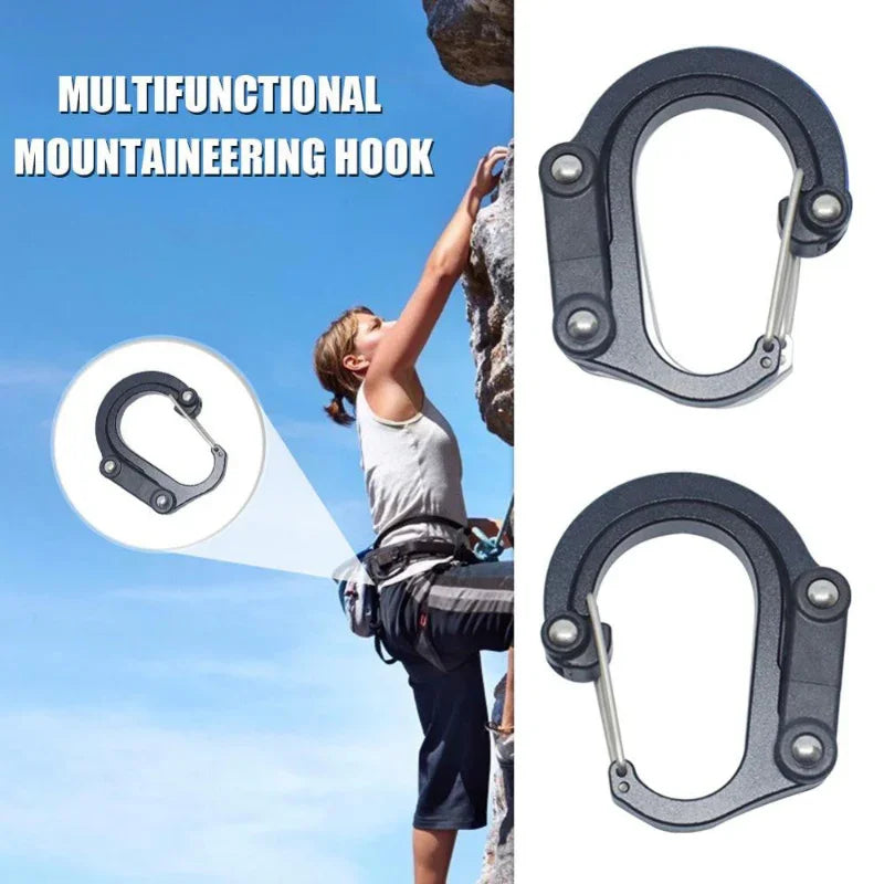 Climber using multifunctional mountaineering hook carabiner on outdoor rock wall.