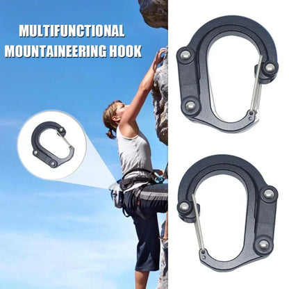 Climber using multifunctional mountaineering hook carabiner on outdoor rock wall.
