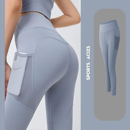 Gray leggings with a pocket feature on a light gray background