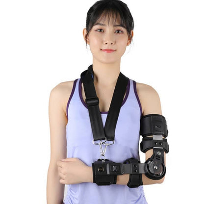 Woman wearing a black shoulder and arm brace on a white background