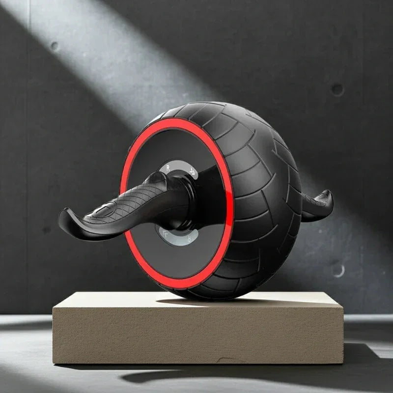 Black ab roller with red accent, textured wheel, ergonomic handles for core workouts