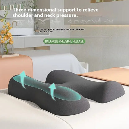 Ergonomic neck and shoulder support pillow with memory foam on a massage table