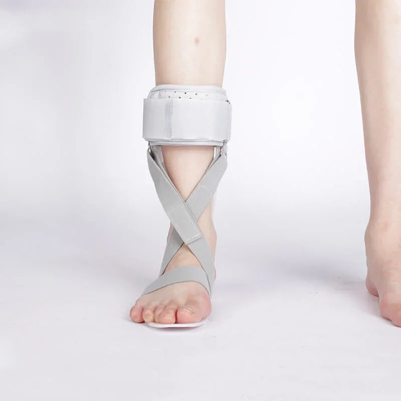 Gray ankle support brace on a white background