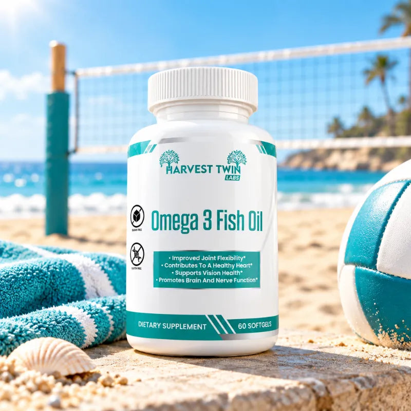 A bottle of Harvest Twin Labs Omega 3 Fish Oil dietary supplement standing on a sandy beach with a towel, seashell, and volleyball in the background.